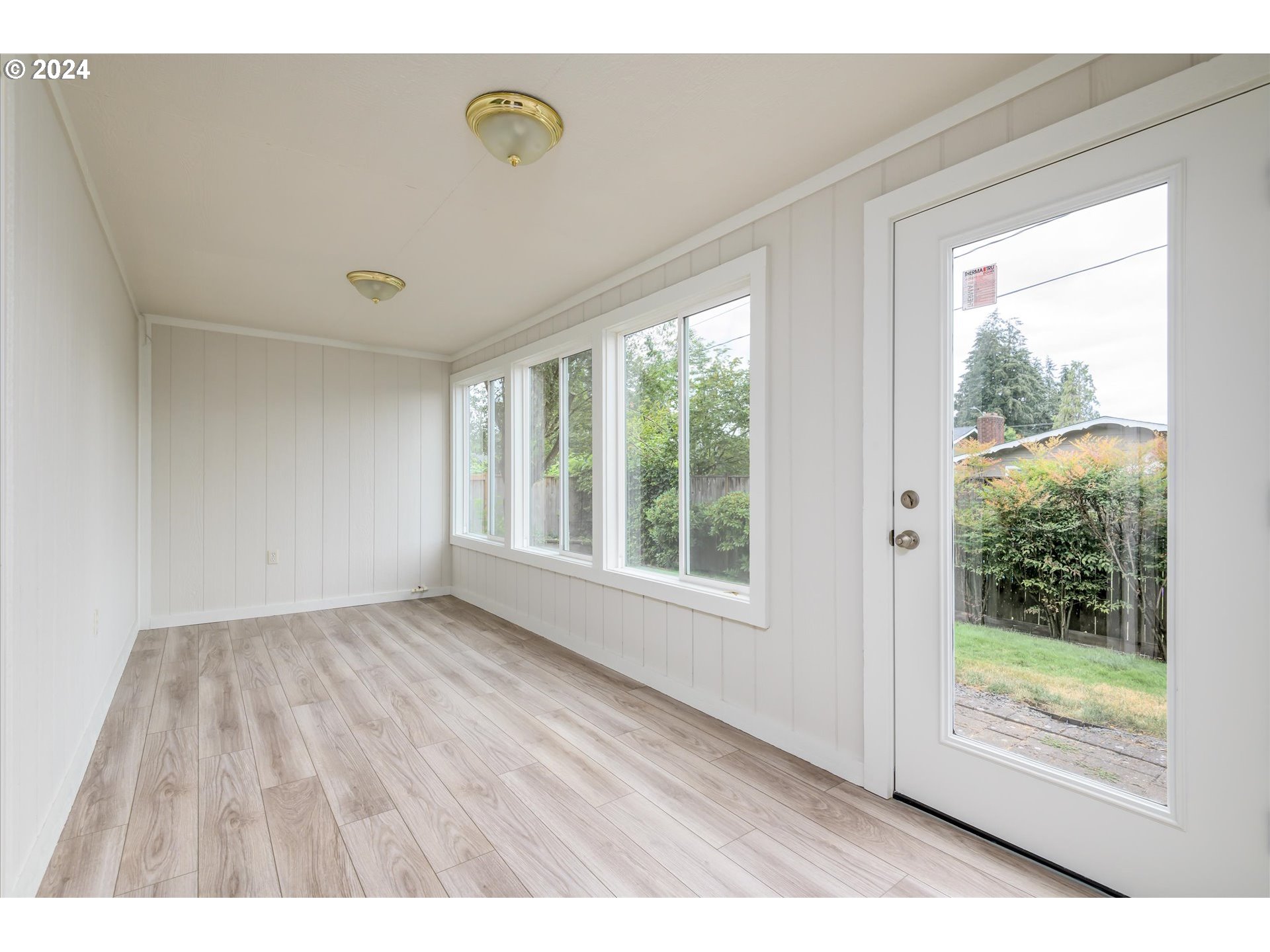 654 62nd Street Springfield, OR 97478 - Photo 24 of 41 a view of an empty room with wooden floor and a window