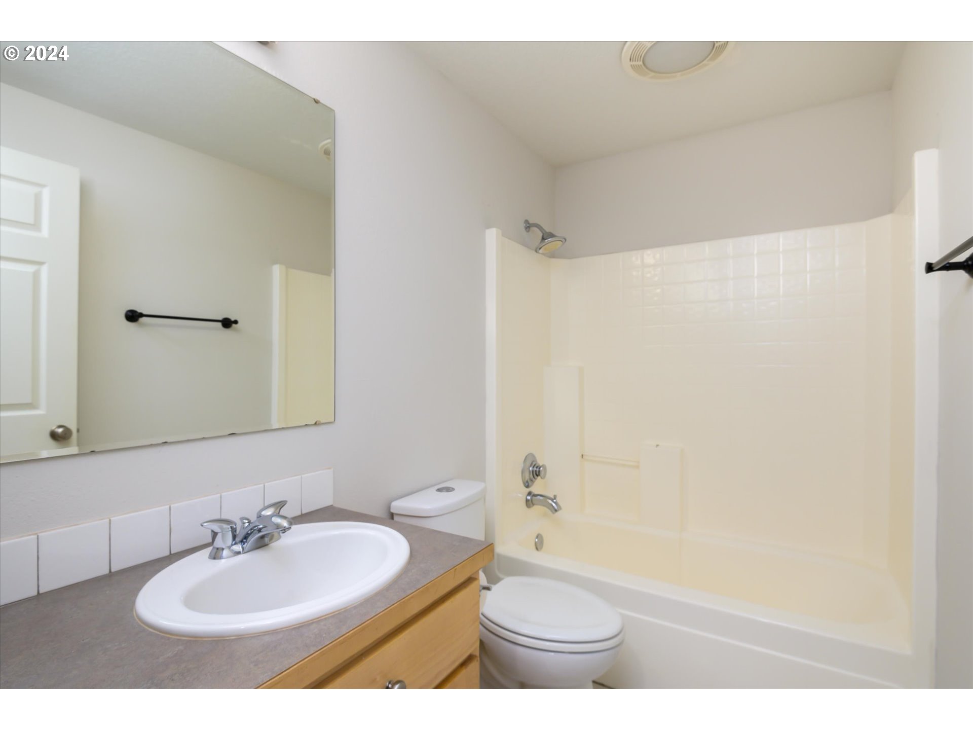 654 62nd Street Springfield, OR 97478 - Photo 27 of 41 a bathroom with a sink a toilet and shower