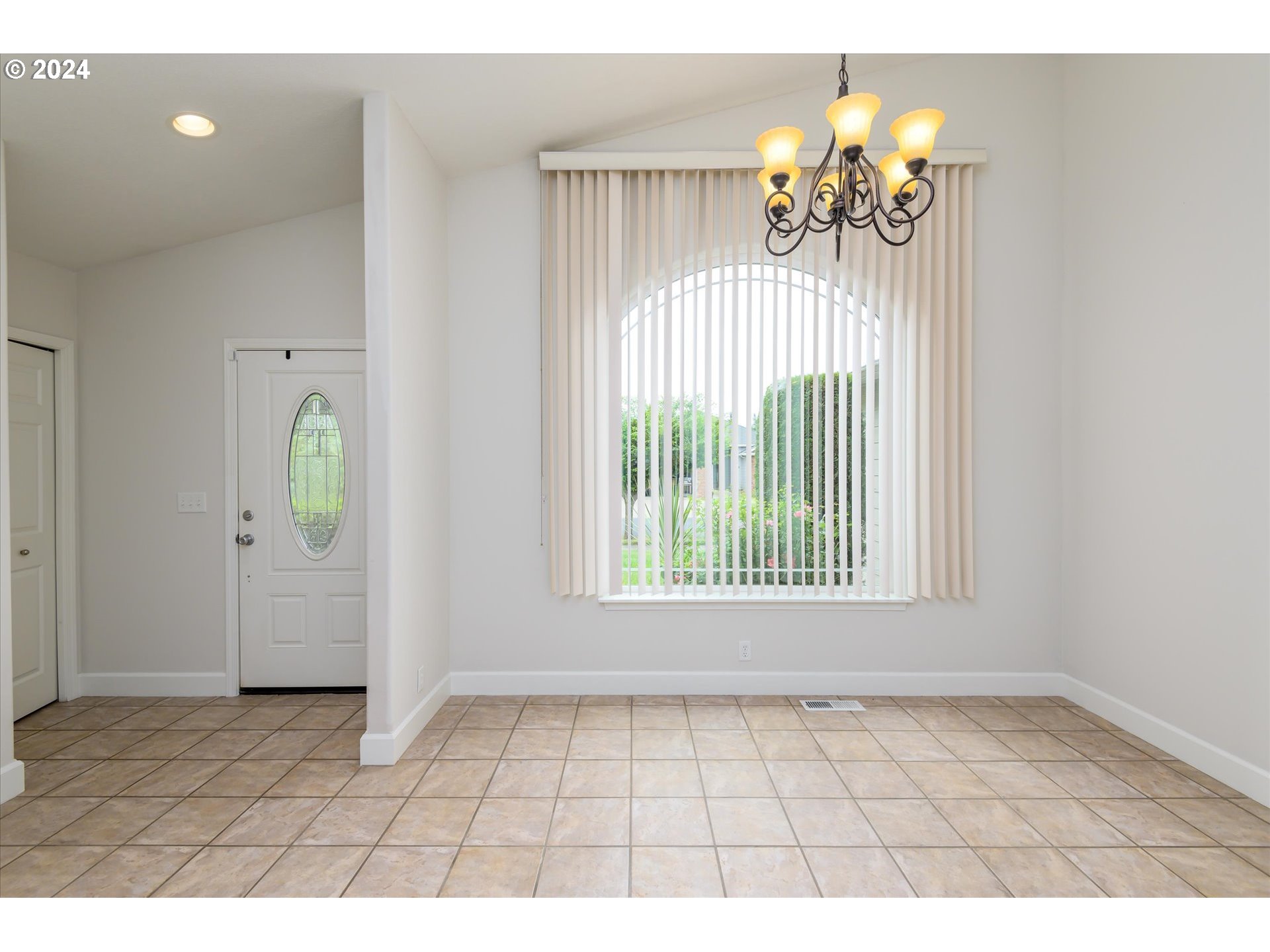 654 62nd Street Springfield, OR 97478 - Photo 7 of 41 a view of an entryway with a chandelier