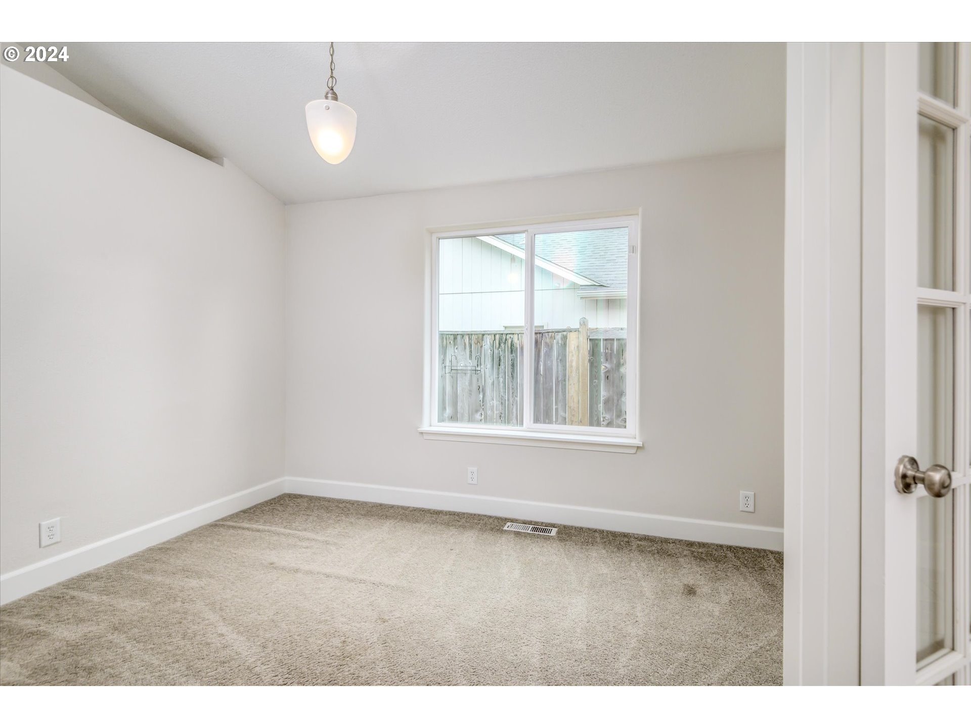 654 62nd Street Springfield, OR 97478 - Photo 9 of 41 a view of an empty room with a window