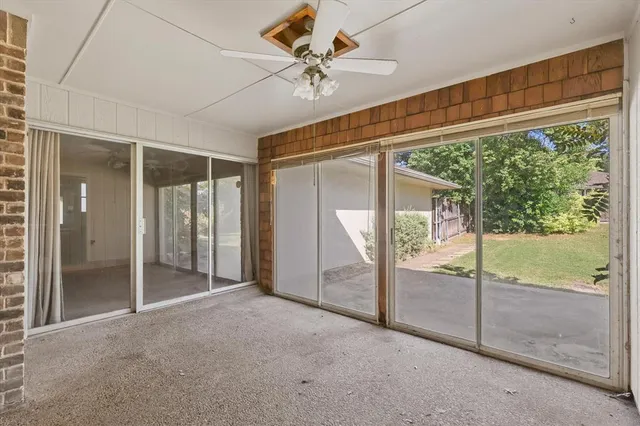 a picture of a bench in front of a building