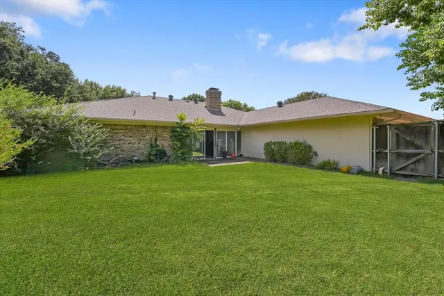 an aerial view of a house with a garden