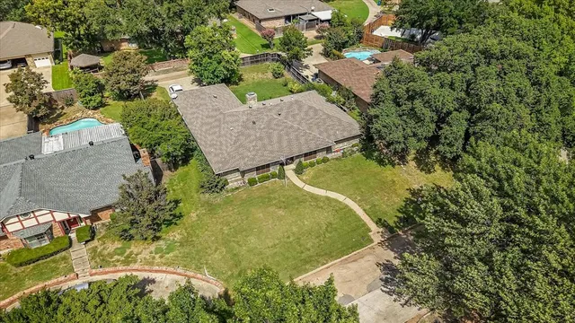 a view of empty room with fireplace and windows