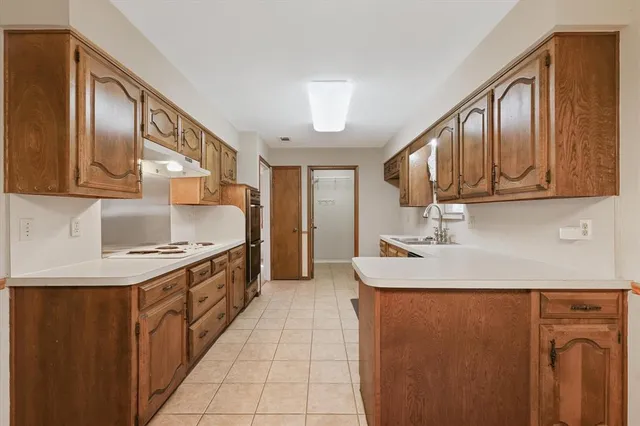 a view of entryway with kitchen island wooden floor