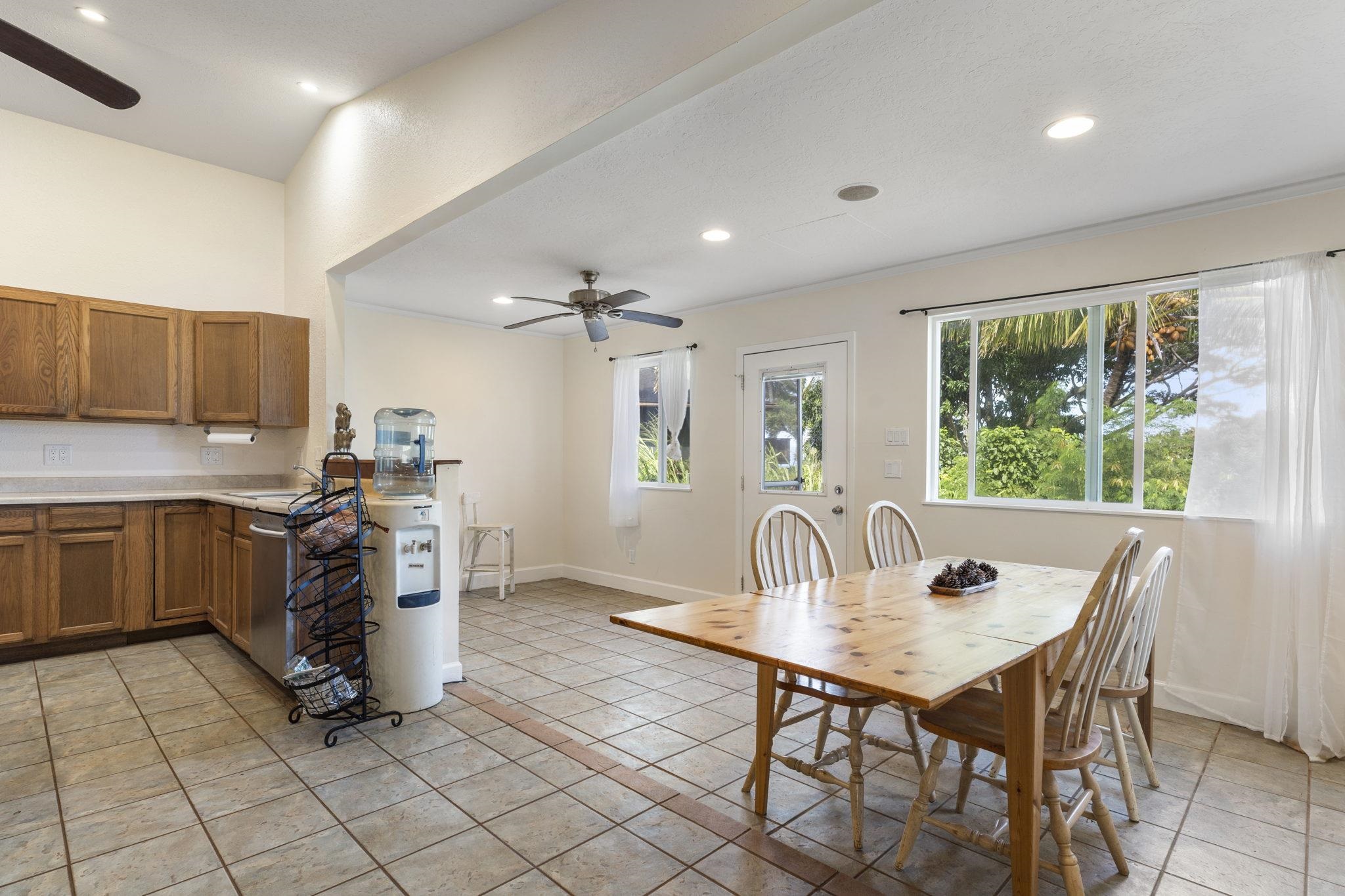 89 Nahele Road Haiku, HI 96708 - Photo 8 of 30 a kitchen with a table chairs and microwave