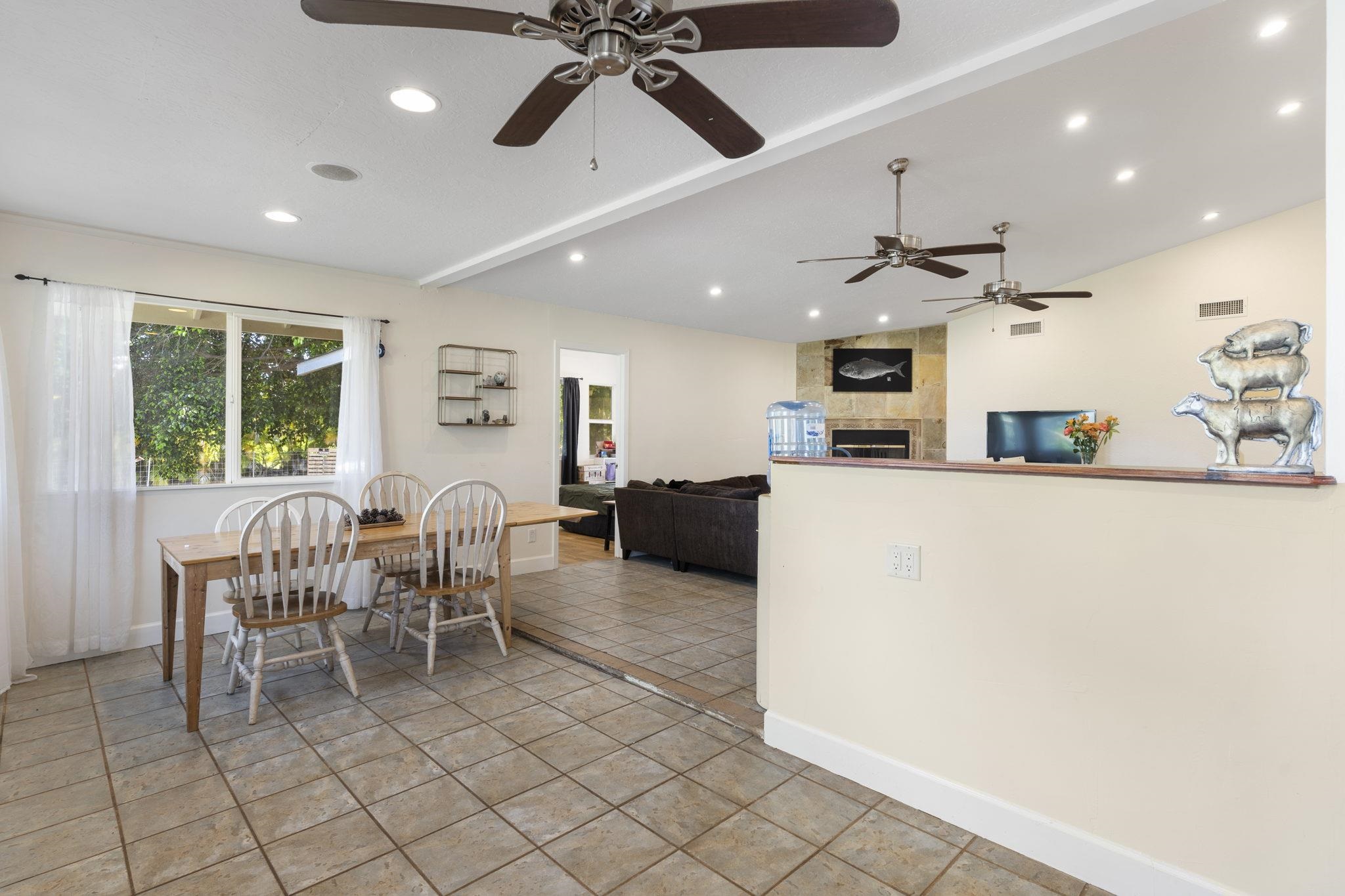 89 Nahele Road Haiku, HI 96708 - Photo 9 of 30 a living room with furniture a flat screen tv and a window