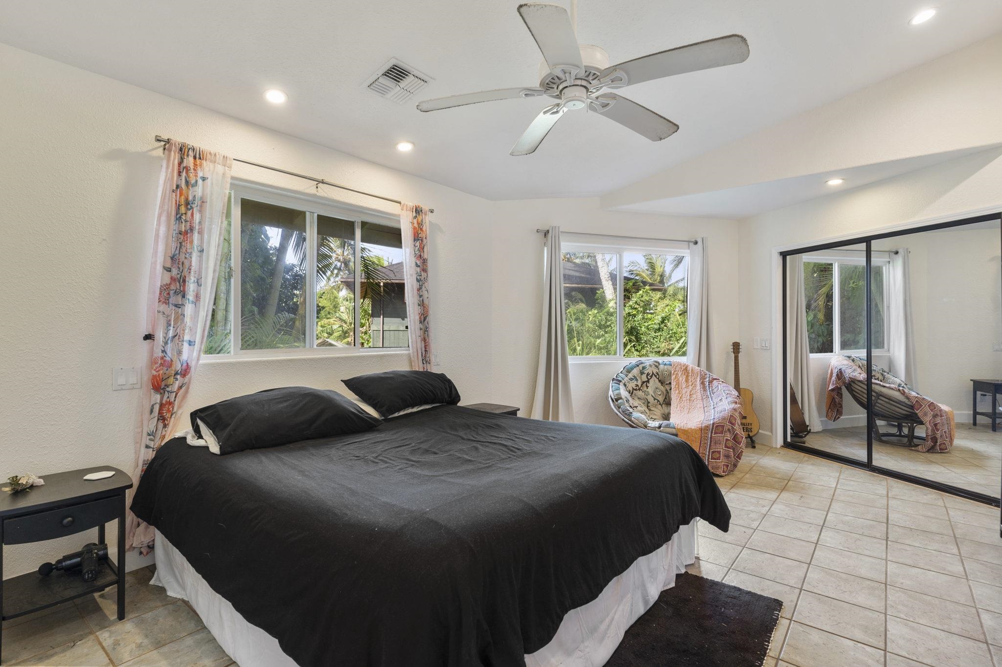 89 Nahele Road Haiku, HI 96708 - Photo 10 of 30 a bedroom with a large bed and a window