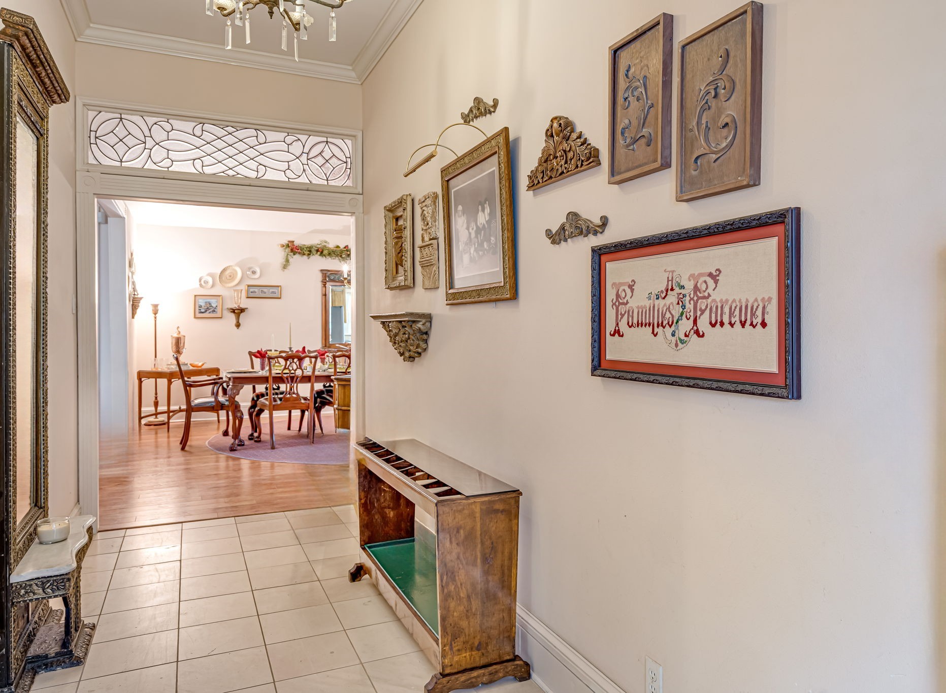 4028 Crosby Cedar Bayou Road Baytown, TX 77521 - Photo 7 of 35 Elegant rear-entry foyer with high ceilings, tile floors, and a decorative transom leading into the formal dining room.