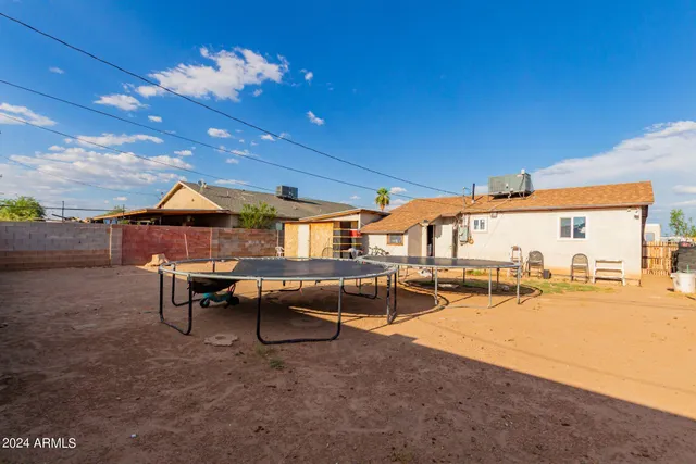 a view of a patio with swimming pool table and chairs