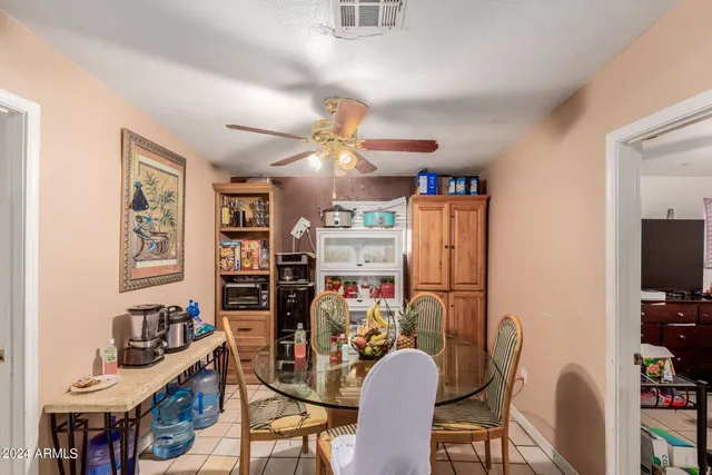 a view of a kitchen and dining room