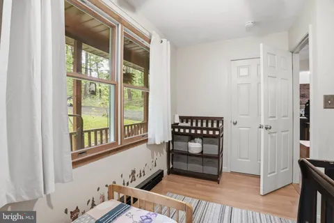 a view of an entryway with wooden floor and a window