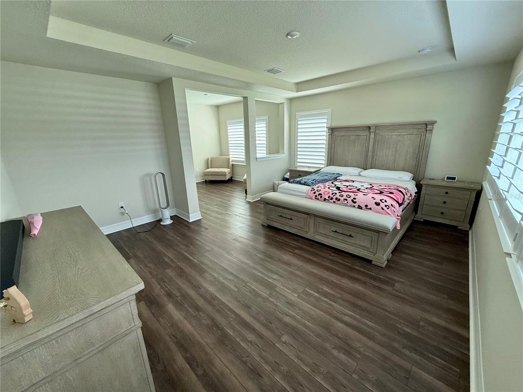 8441 Pk Clf Way Orlando, FL 32836 - Photo 34 of 59 a spacious bedroom with a bed and window