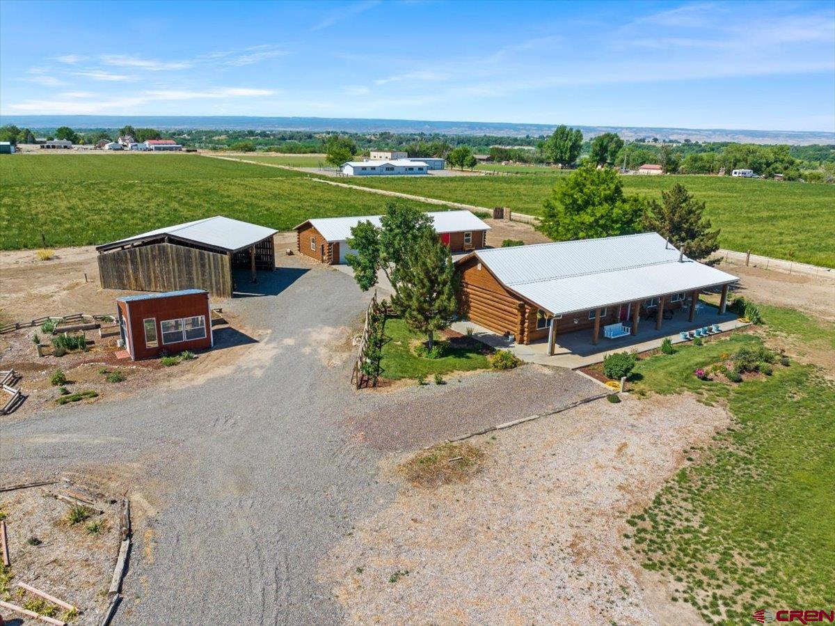 2083 Pioneer Road Delta, CO 81416 - Photo 40 of 45 an aerial view of a house with garden space and ocean view