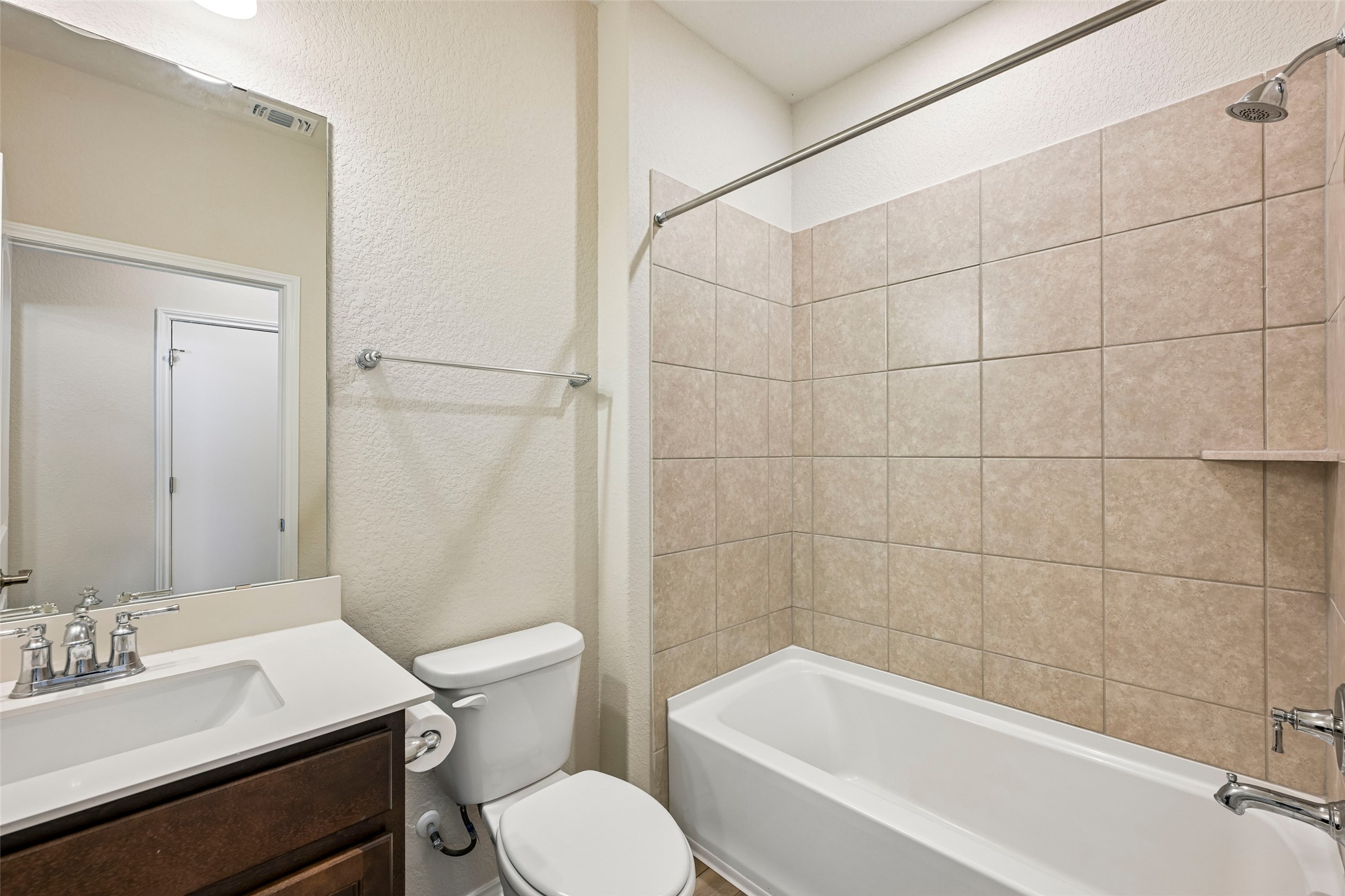401 Yorktown Street Georgetown, TX 78633 - Photo 29 of 38 Bathroom with a single vanity, undermount sink, and a combination shower and tub