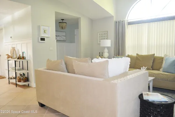 a living room with furniture and a table