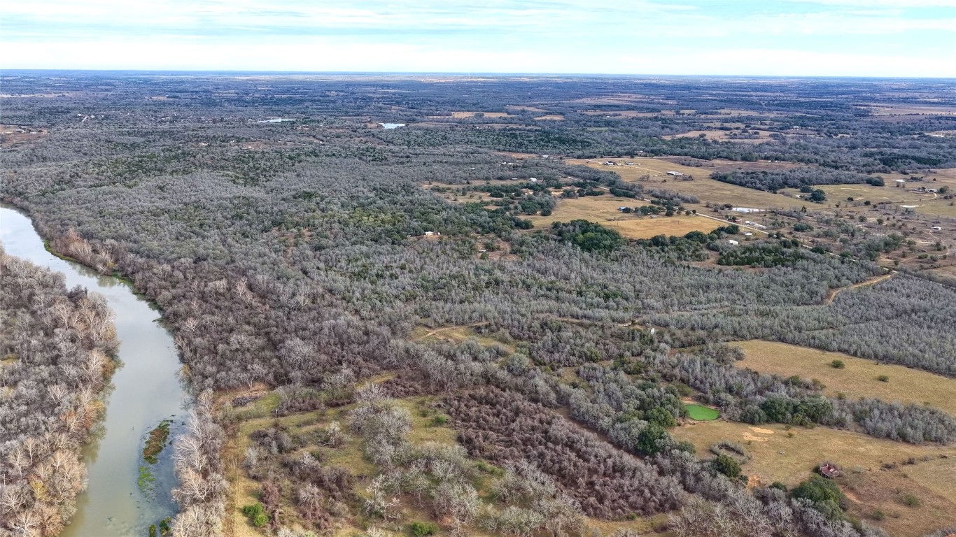 256 Greasy Bend Road Smithville, TX 78957 - Photo 25 of 36 Bird's eye view of a large body of water and a heavily wooded area