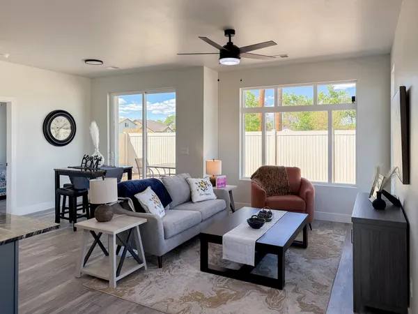 a living room with furniture and a large window
