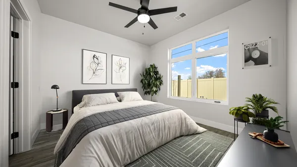 a bedroom with a bed potted plant with the outer view