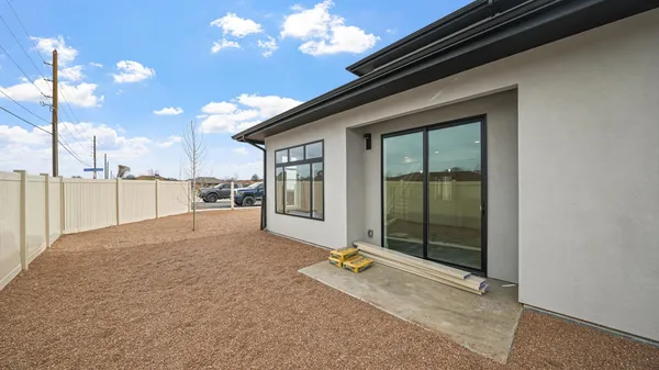 a view of a backyard of the house
