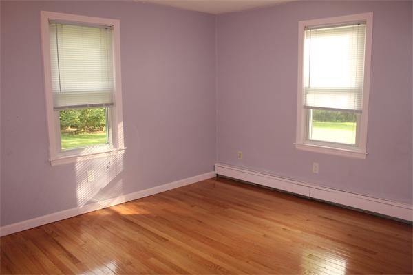 689 Walnut Plain Road Rochester, MA 02770 - Photo 10 of 22 an empty room with a window