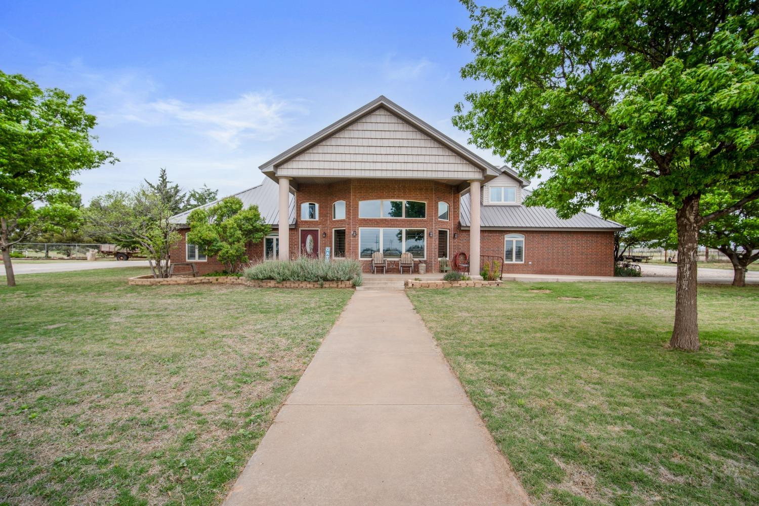 front view of a house with a yard