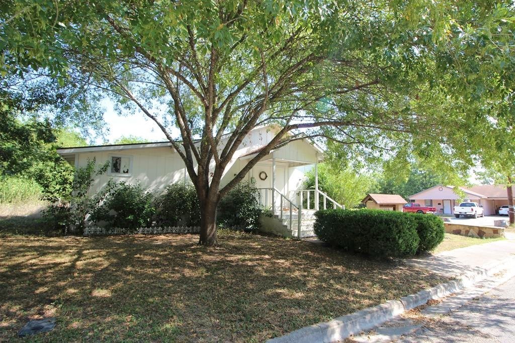 823 Monterrey Street Lockhart, TX 78644 - Photo 1 of 1 a view of backyard with tree