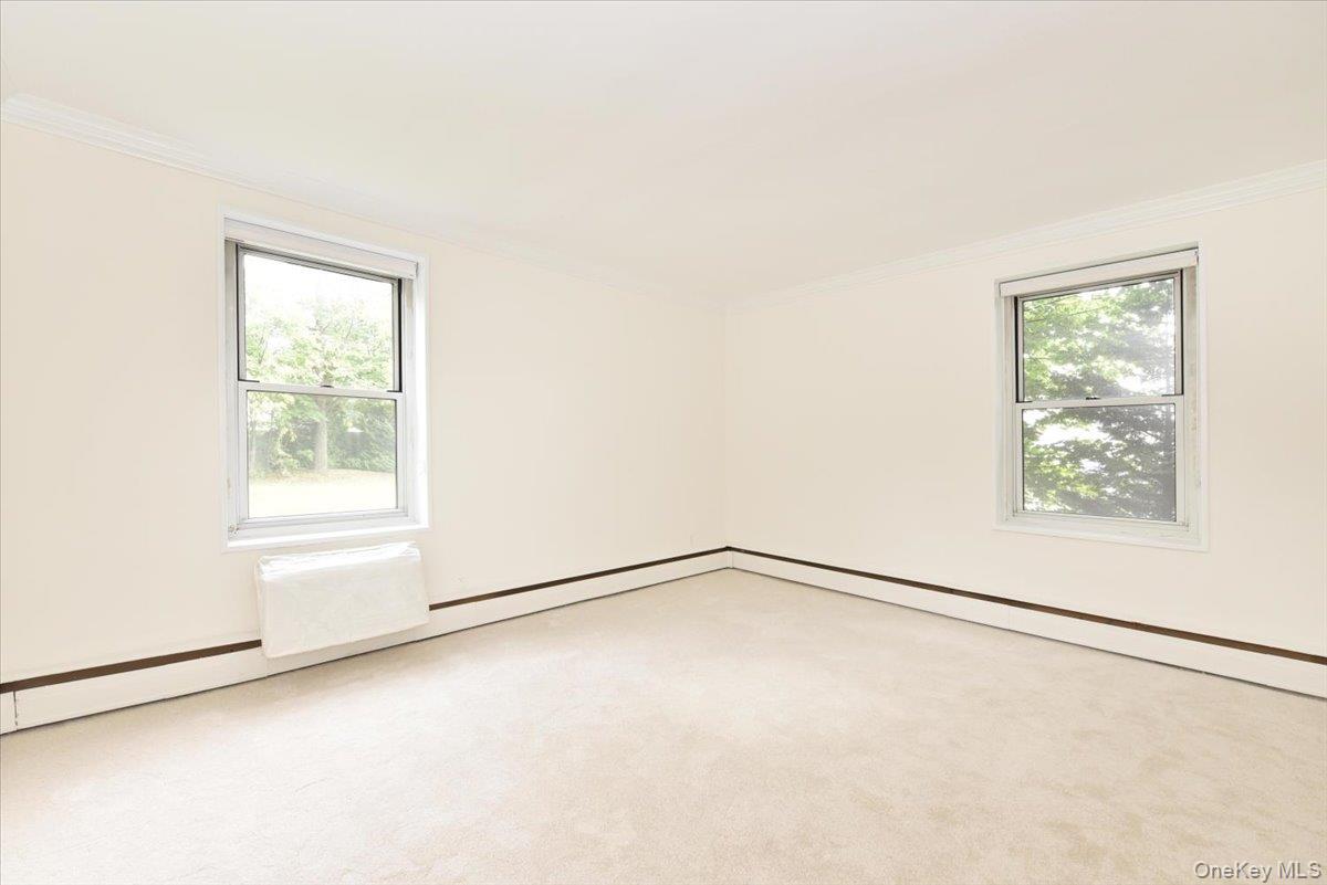 195 South Middle Neck Road, Unit 2L Great Neck, NY 11021 - Photo 14 of 36 a view of an empty room with a window