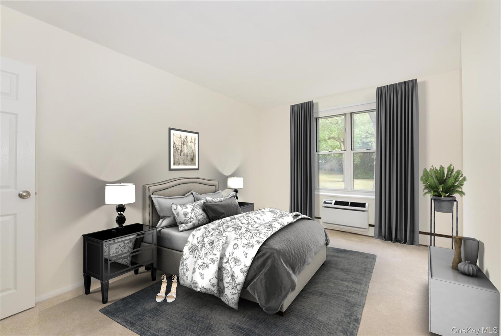 195 South Middle Neck Road, Unit 2L Great Neck, NY 11021 - Photo 16 of 36 a bedroom with a bed and a large window