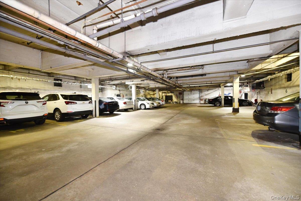 195 South Middle Neck Road, Unit 2L Great Neck, NY 11021 - Photo 25 of 36 a view of cars parked in a parking