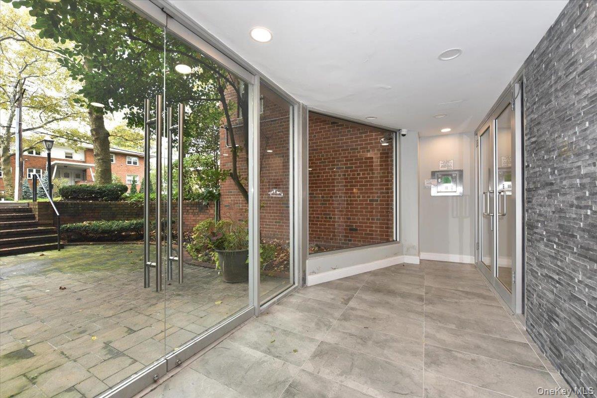 195 South Middle Neck Road, Unit 2L Great Neck, NY 11021 - Photo 26 of 36 a view of a porch with chairs and backyard