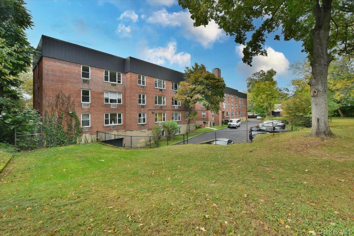 195 South Middle Neck Road, Unit 2L Great Neck, NY 11021 - Photo 29 of 36 a view of a building with a yard