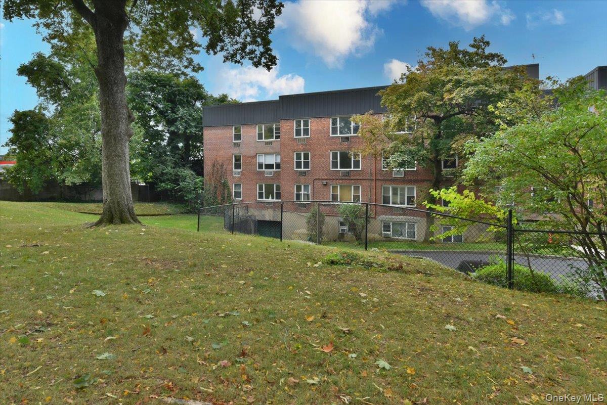 195 South Middle Neck Road, Unit 2L Great Neck, NY 11021 - Photo 30 of 36 a view of a big yard in front of a house