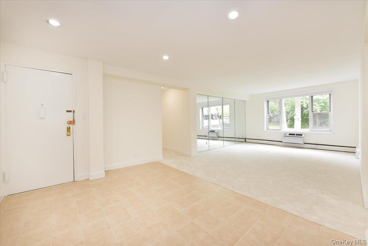 195 South Middle Neck Road, Unit 2L Great Neck, NY 11021 - Photo 6 of 36 a view of an empty room with a window