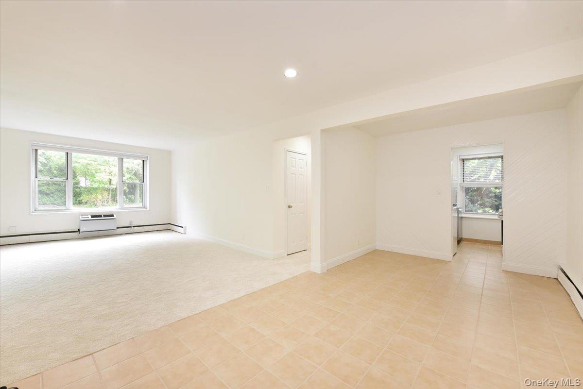 195 South Middle Neck Road, Unit 2L Great Neck, NY 11021 - Photo 8 of 36 an empty room with windows