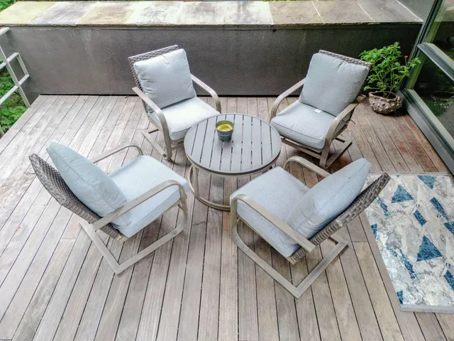 a view of a garden with plants and large trees