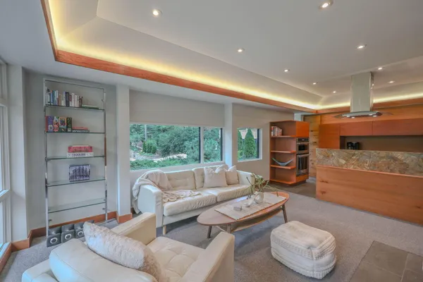 a living room with furniture and a large window