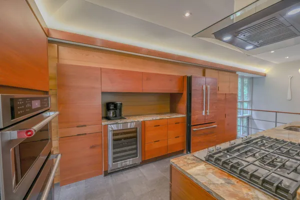 a kitchen with a stove and a microwave