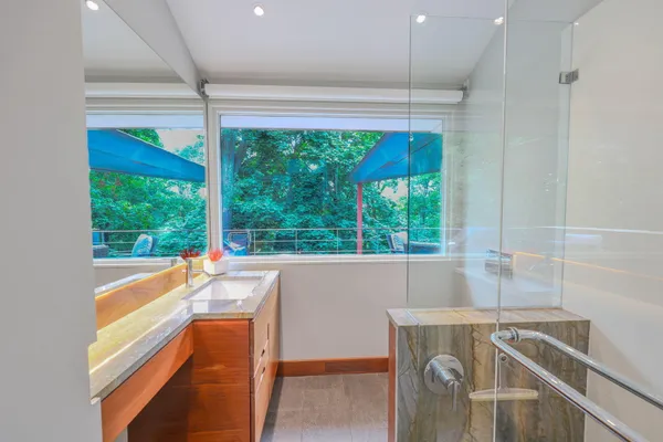 a kitchen with a window a sink and a counter top space