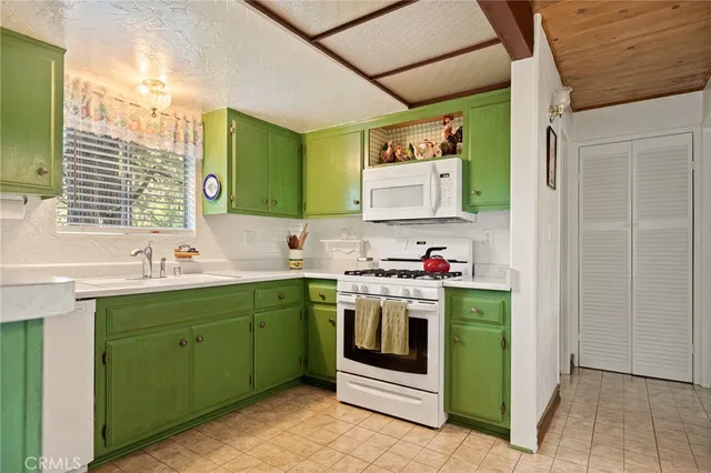 a utility room with a sink dryer and washer