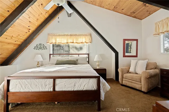 a bedroom with furniture and a window