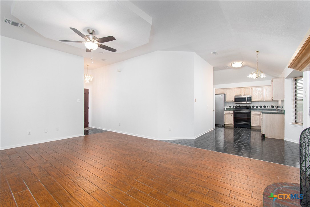 5420 Williams Drive Temple, TX 76502 - Photo 9 of 24 a view of empty room with wooden floor