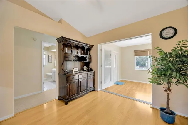 a kitchen with stainless steel appliances granite countertop a refrigerator a stove a sink a counter space and cabinets