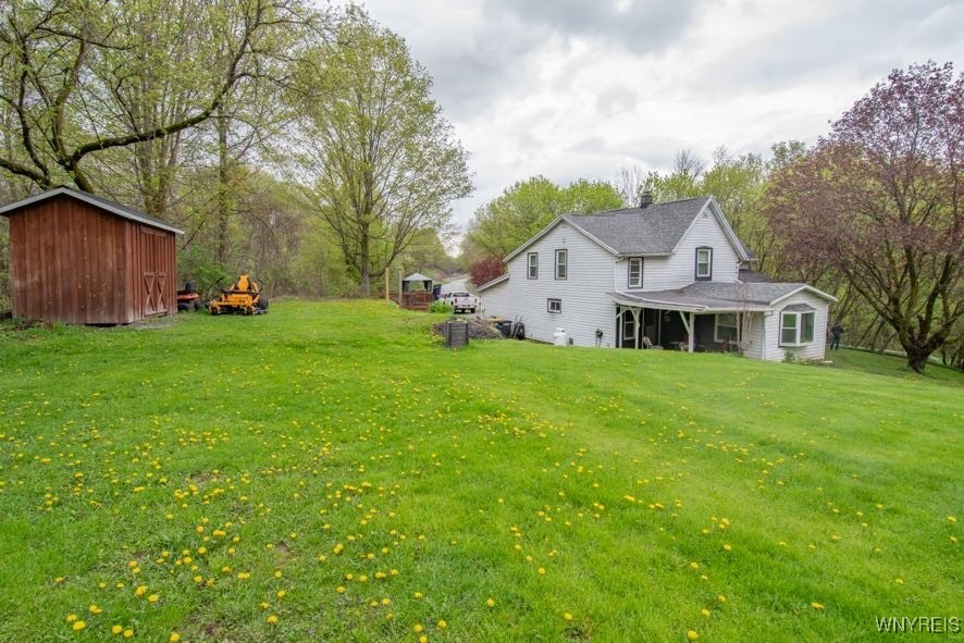 4182 Dutton Road Gainesville, NY 14550 - Photo 1 of 1 View of yard, patio, and shed