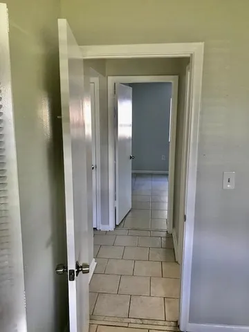 a bathroom with a shower and a glass door