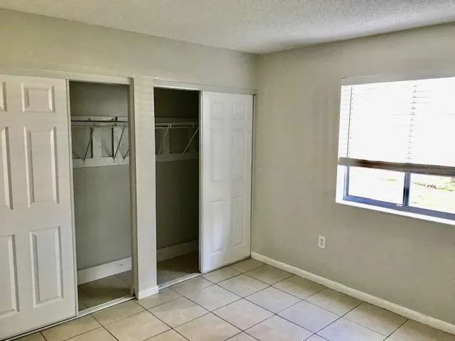 an empty room with closet door