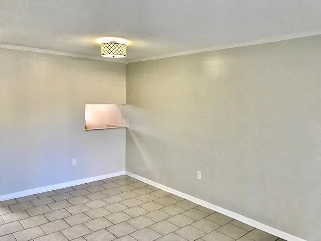 a view of a hallway with wooden shelves