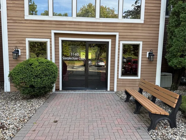 a view of a two chairs in the balcony