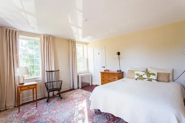 a bathroom with a sink a toilet and a shower