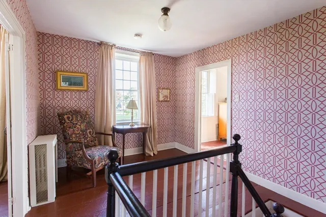 a bedroom with furniture and a window