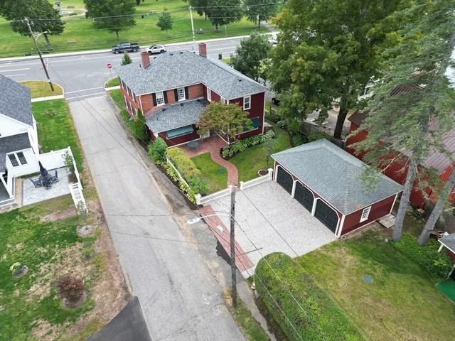 a aerial view of a house with a yard